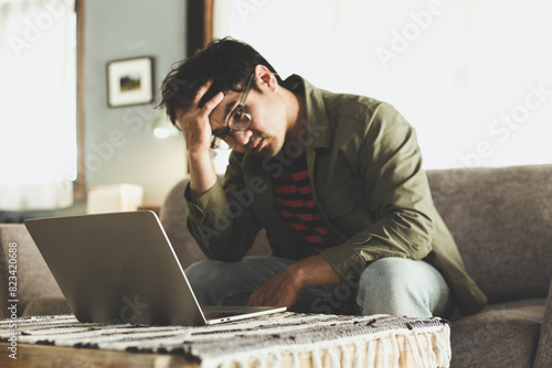 sad depression serious people from work,study stress problem.asian man feeling tired suffering using computer working work place.concept global economic,health problems