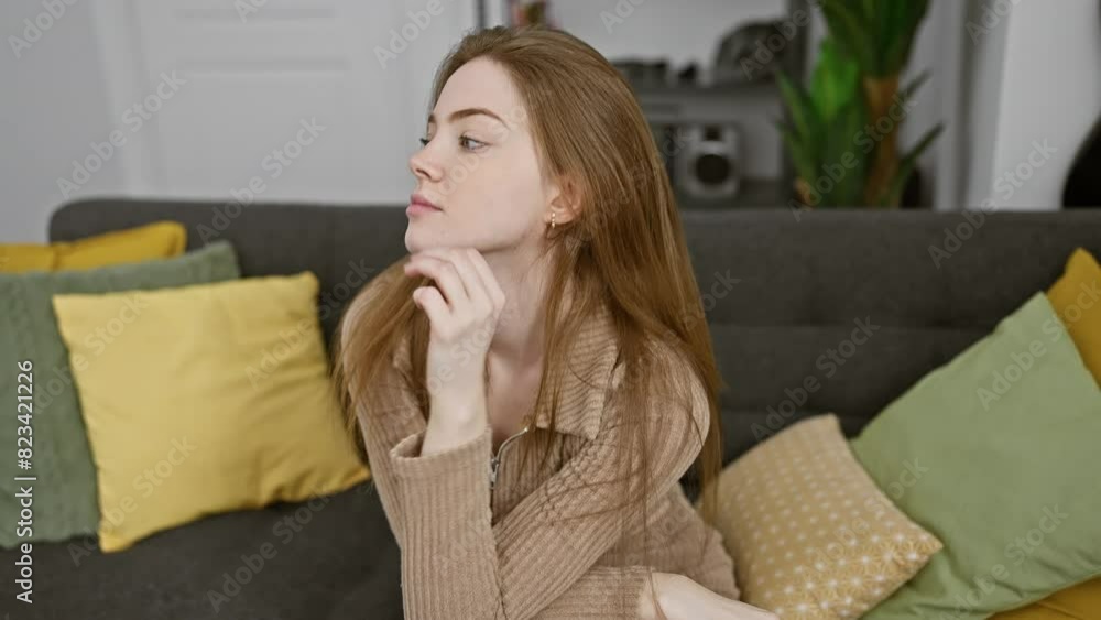 Pensive young blonde woman at home, wearing a cozy sweater, hand on chin, lost in thoughtful doubt. smiling with a cheerful yet puzzled expression as she juggles the question in mind. Pensive young blonde woman at home, wearing a cozy sweater, hand on chin, lost in thoughtful doubt. smiling with a cheerful yet puzzled expression as she juggles the question in mind.