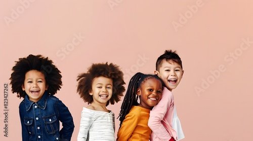 A joyful group of diverse children standing in a row and laughing against a peach-colored background  showcasing their vibrant personalities and happiness.