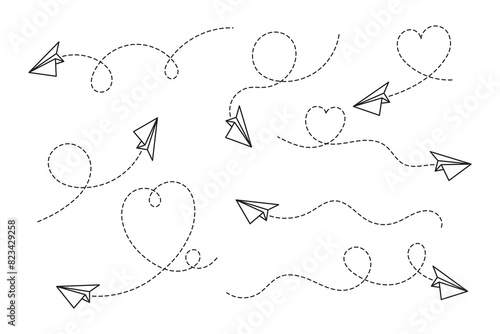 A set of paper airplanes that fly, leaving behind a dotted trail of curved lines and hearts.