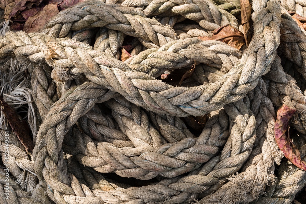 Closeup of old coiled thick nylon rope. Closeup of old coiled thick nylon rope.