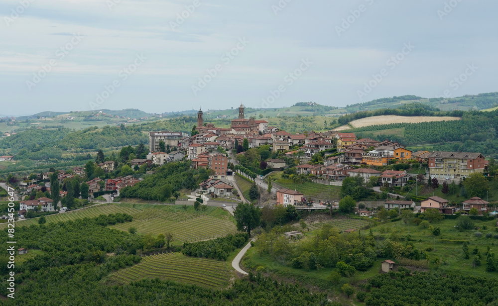 A view of Piedmont countryside and a village on the mountain top. View from Grinzane Cavour 
