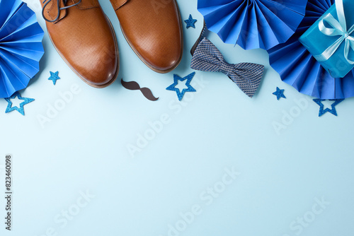 Father's Day festive decorations with shoes, bowtie, mustache cutouts, and blue stars. Perfect for Father's Day parties and celebrations