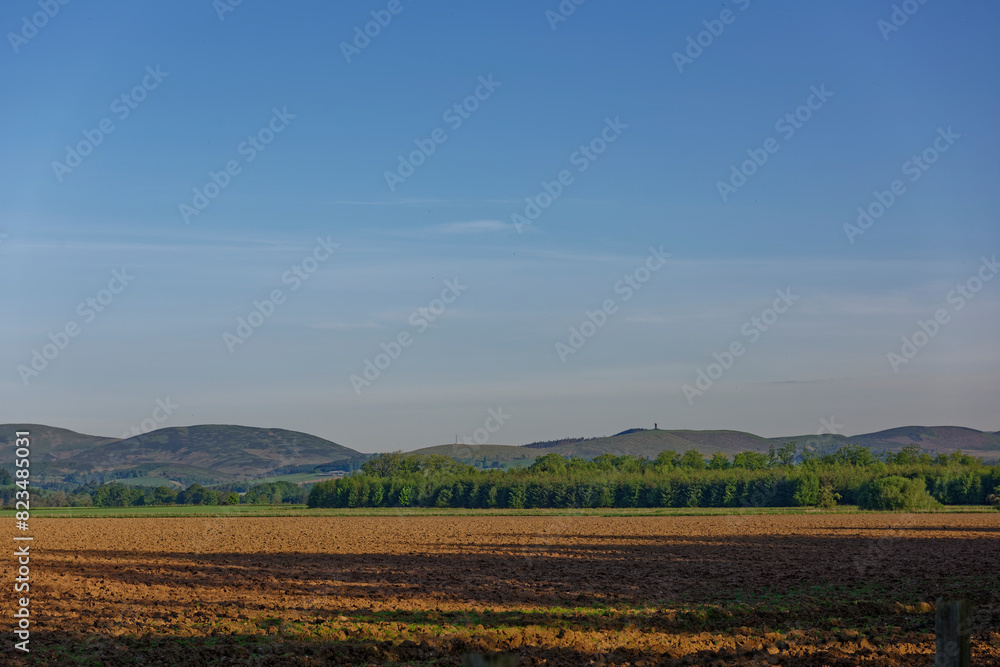 Looking North towards the Angus Glens and Tulloch Hill with the Airlie Monument, from the flat floor of the Strathmore Valley near to the Village of Memus. Looking North towards the Angus Glens and Tulloch Hill with the Airlie Monument, from the flat floor of the Strathmore Valley near to the Village of Memus.