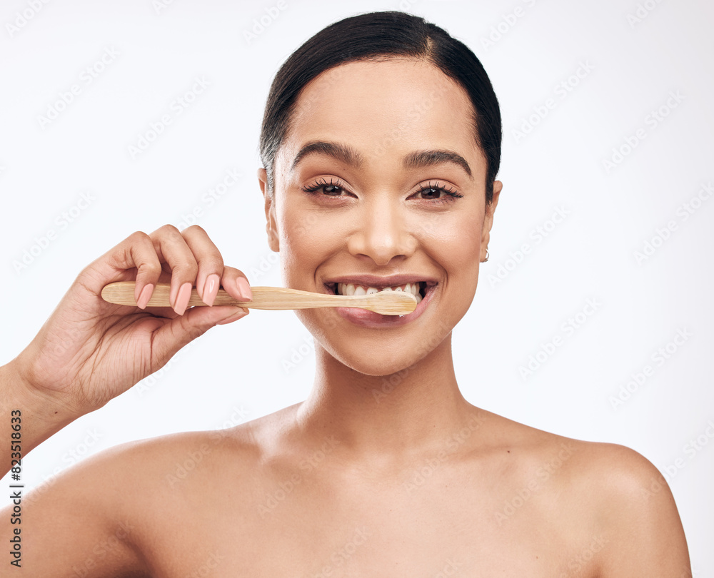 Portrait, woman and brushing teeth in studio for dental care, hygiene and fresh on white background. Bamboo toothbrush, happy and female person with organic tool for cleaning, routine and wellness Portrait, woman and brushing teeth in studio for dental care, hygiene and fresh on white background. Bamboo toothbrush, happy and female person with organic tool for cleaning, routine and wellness