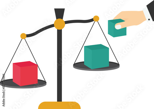 A hand put a cube to add weight at one side.Market intervention, adjustment concepts.

