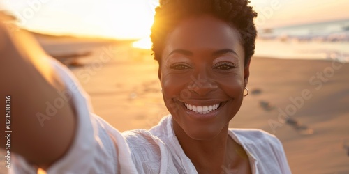 Woman taking a selfie on the beach or pointing at sunrise, resting and posting on holiday. Happy black vacationer, picture and ocean, fun or freedom. photo