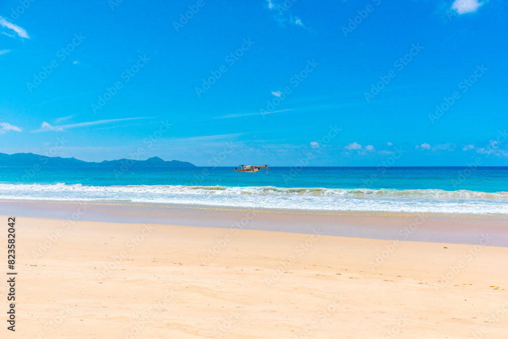 Drone hovering over a tropical beach Drone hovering over a tropical beach