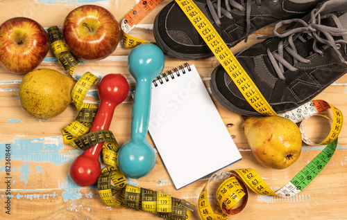 fruit for weight loss with measuring tape and equipment for exercise and diet, weight loss