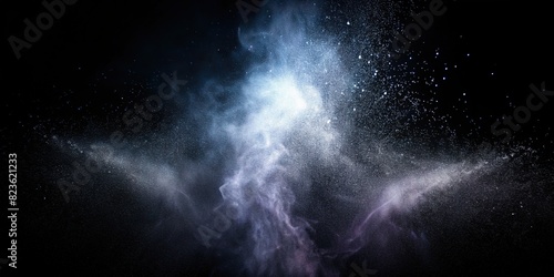 Spray jet of water vapor in silhouette on black background photo