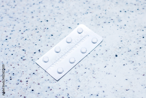 Electric blue blister pack of pills on counter top