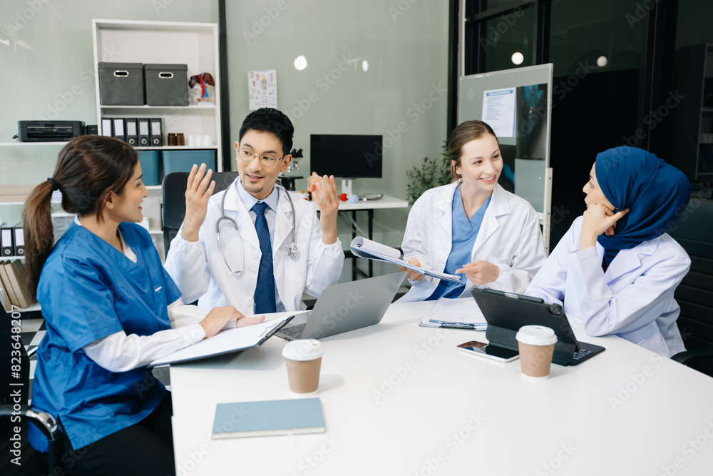 Fototapeta premium Medical, meeting and laptop for team in discussion, brainstorming and planning. Doctor, nurse on desk show diversity in collaboration, teamwork or workshop in hospital .