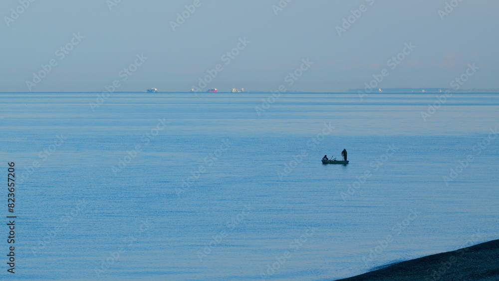Craft Fishing. Unrecognizable Figures Of Fishermen In A Boat. Small Fishing Boat Sailing In Sea. Still.