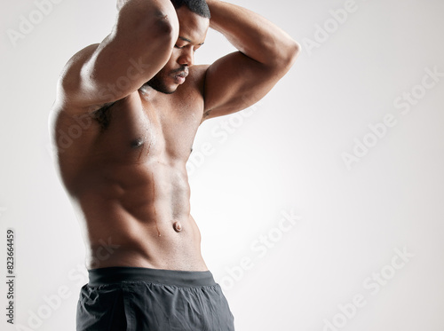 Fotografía Black man, muscular and fitness with abs for workout, exercise or training on a white studio background