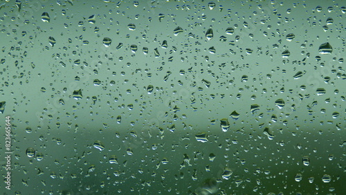 Water Drops On Glass Background. Reflected Light. Pan.