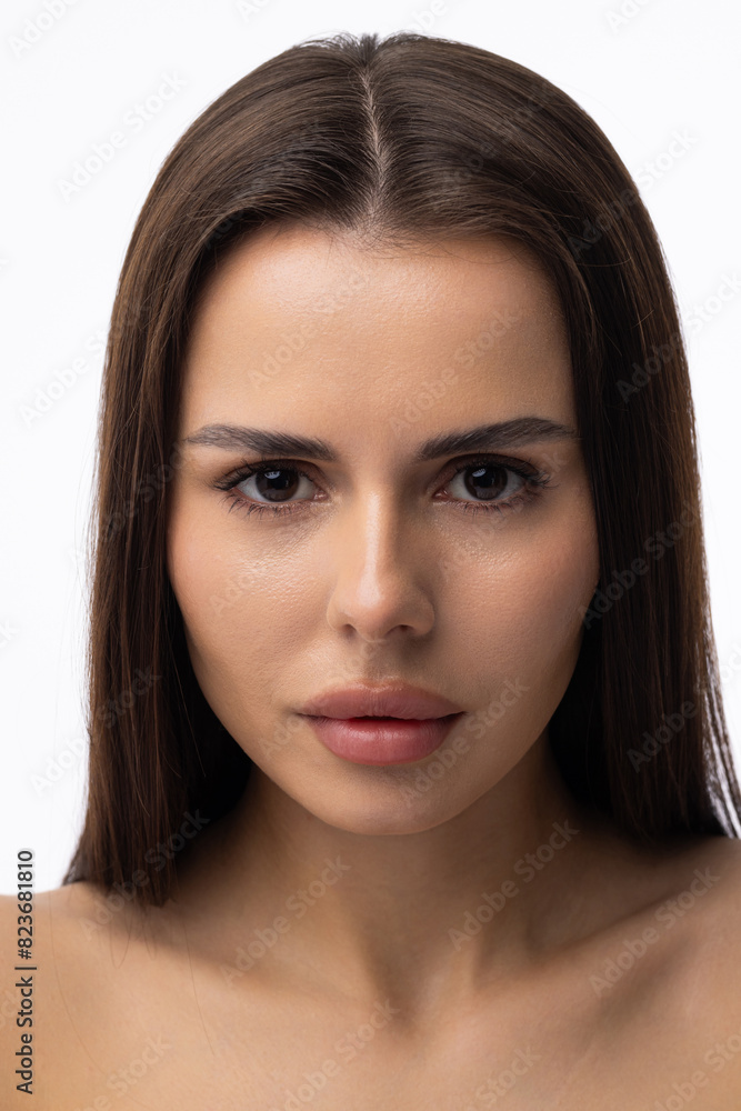 Beautiful young woman with clean perfect skin. Portrait of beauty model with natural nude make up and touching her face. Beautiful young woman with clean perfect skin. Portrait of beauty model with natural nude make up and touching her face.