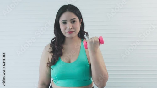 chubby woman with dumbbells