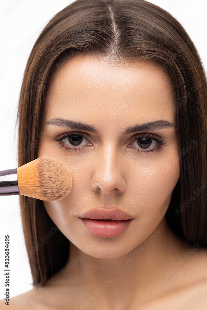 Portrait woman make up brushes in hand posing on white background Portrait woman make up brushes in hand posing on white background