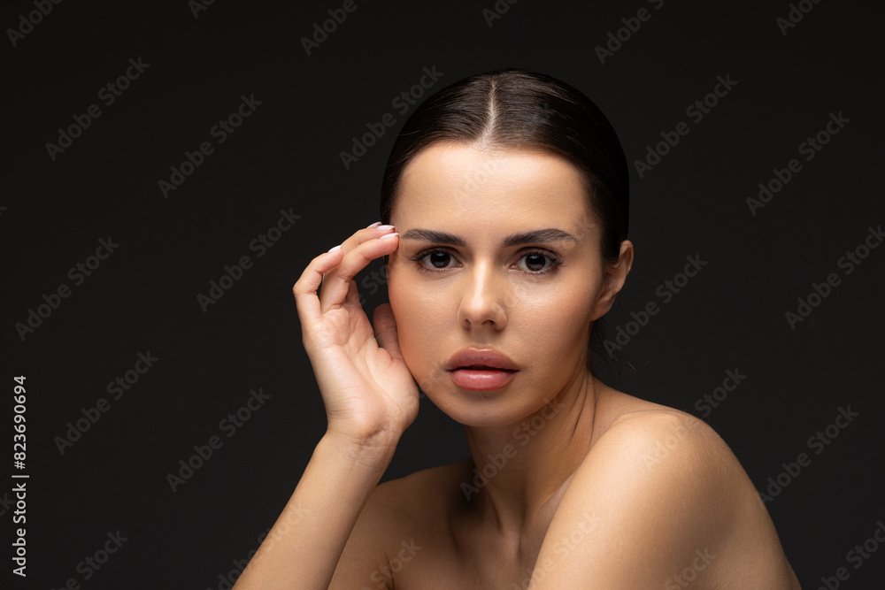 Young pretty model with bright make-up on black background Young pretty model with bright make-up on black background