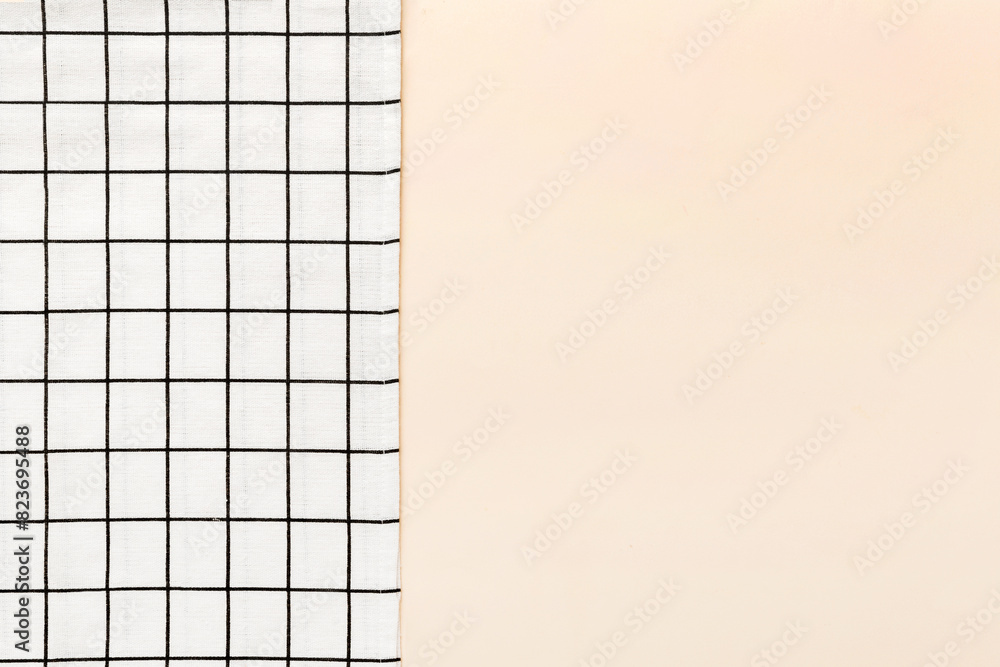 Fototapeta premium top view with white empty kitchen napkin isolated on table background. Folded cloth for mockup with copy space, Flat lay. Minimal style