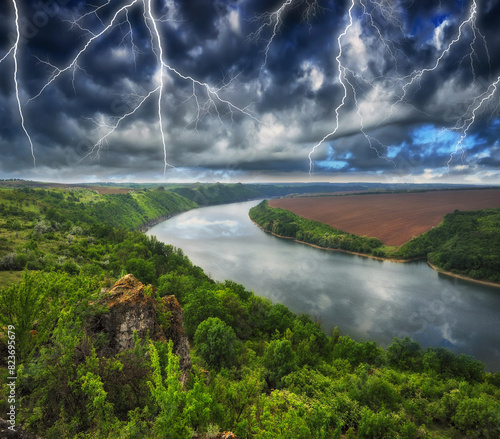Peaceful view of the canyon Dnister river in a storm. Dramatic landscape with thunderstorm. Powerful lightning over the river. Nature of Ukraine