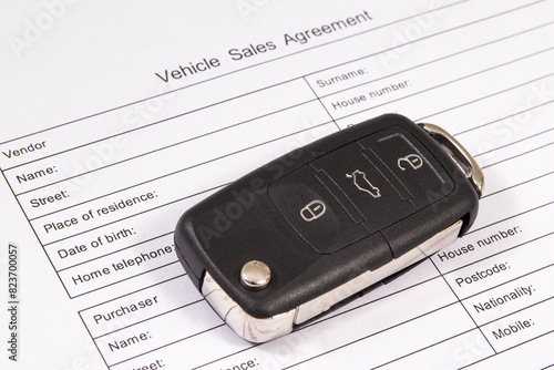 Car key and vehicle sales agreement. Sales or purchases new or used vehicle