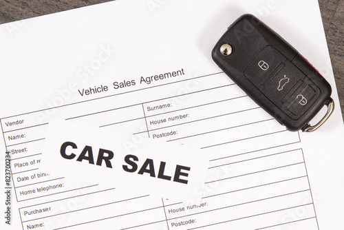 Car key, inscription car sale and form of vehicle sales agreement. Sales or purchases new or used vehicle