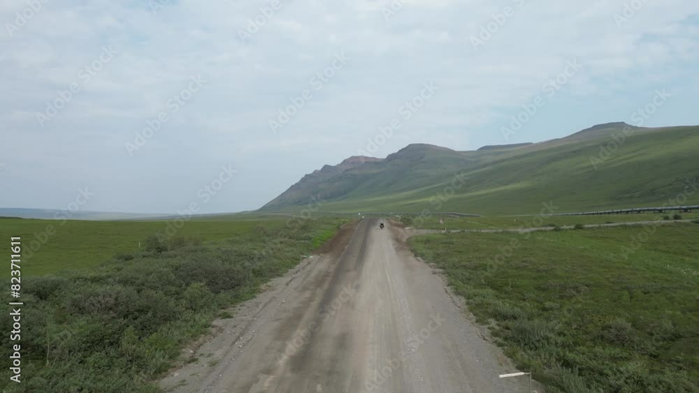 Motorcycle on Road in Alaska mountain and open plans - Drone Footage Motorcycle on Road in Alaska mountain and open plans - Drone Footage