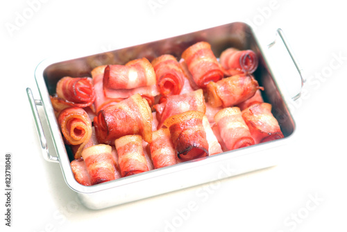 Close up of fried bacon pieces isolated white background.