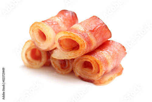 Close up of fried bacon pieces isolated white background.