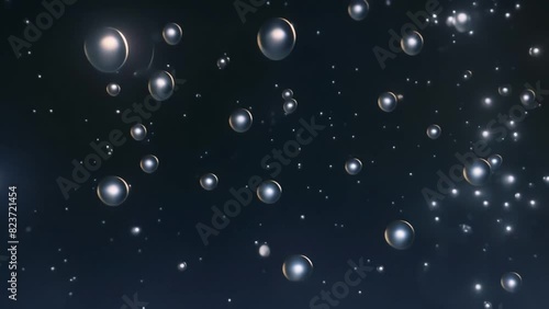 water bubbles floating particles asbtract dark background motion photo