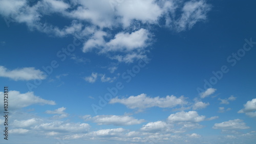 Clear gradient blue sky in tropical summer sunlight. Beautiful sunny clear blue sky in tropical summer with stratocumulus clouds. Timelapse.