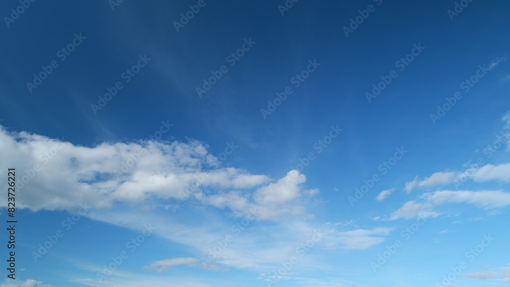 Tropical summer sunlight and sunrays. Colorful cumulus and cirrus on different layers clouds in the sky after heavy rain. Timelapse.