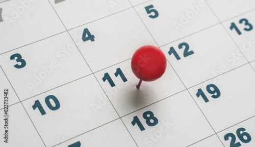 Fotografie eleventh day of the month on the calendar marked with red pin