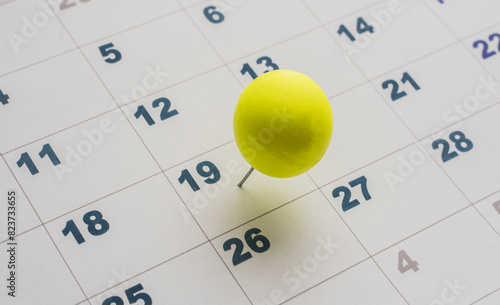 nineteenth day of the month on the calendar marked with yellow pin photo