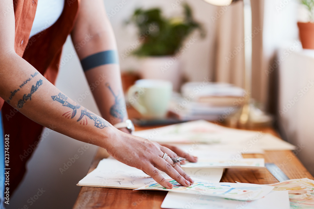Obraz premium Hands, woman and designer with sketch for planning at desk with creativity, small business and drawing in home. Seamstress, dressmaker and mood board in apartment for art project or fashion week