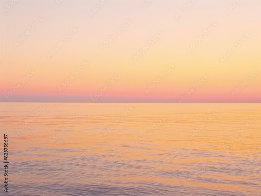 Obraz premium A sunrise over a calm ocean, with soft hues of orange and pink blending seamlessly, creating a serene background that evokes a sense of rhythm and peace