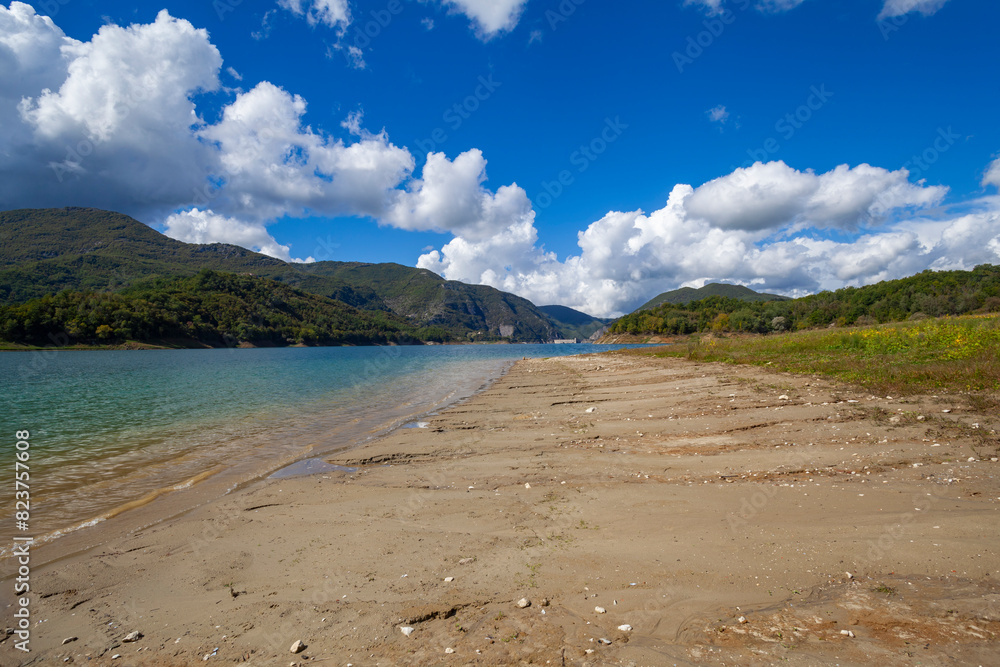 Lago Del Salto, in Lazio region (Italy), reflects the sky and greenery Lago Del Salto, in Lazio region (Italy), reflects the sky and greenery