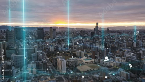 Modern city at sunset with dynamic data visualization overlays, showcasing digital analytics across the skyline made of modern skyscrapers photo