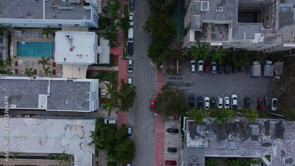 Aerial top down view of Miami city streets architecture, Miami buildings rooftops and cars driving. Summer vacations. Beautiful View on Residential house, Hotels and Resorts in South Beach Miami Aerial top down view of Miami city streets architecture, Miami buildings rooftops and cars driving. Summer vacations. Beautiful View on Residential house, Hotels and Resorts in South Beach Miami