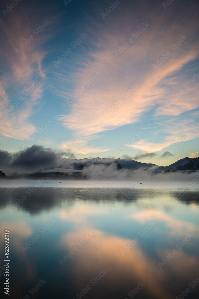 Cloud reflections in lake at sunrise Cloud reflections in lake at sunrise