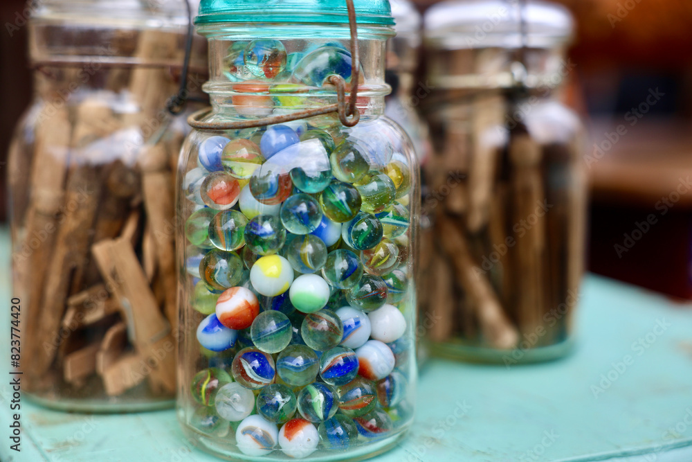 glass jar with antique marbles glass jar with antique marbles