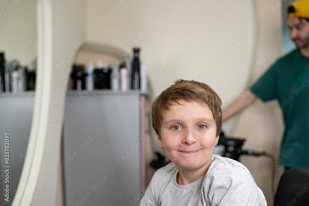 Barber with giving boy haircut Barber with giving boy haircut