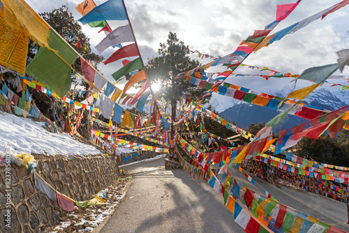 Landscape of Mountaind Road with Prayer Flags in Yunnan,  China photo