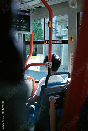 Japanese boy in a bus in Kyoto photo