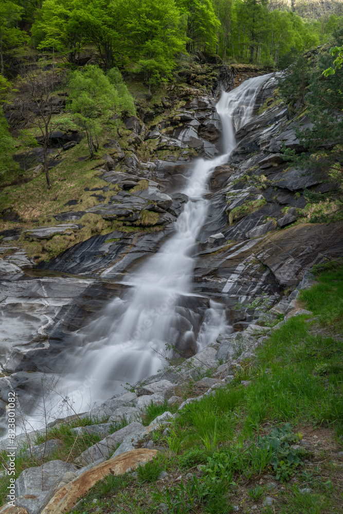 Waterfall in spring evening in valley of river Diveria in Gondo village Waterfall in spring evening in valley of river Diveria in Gondo village