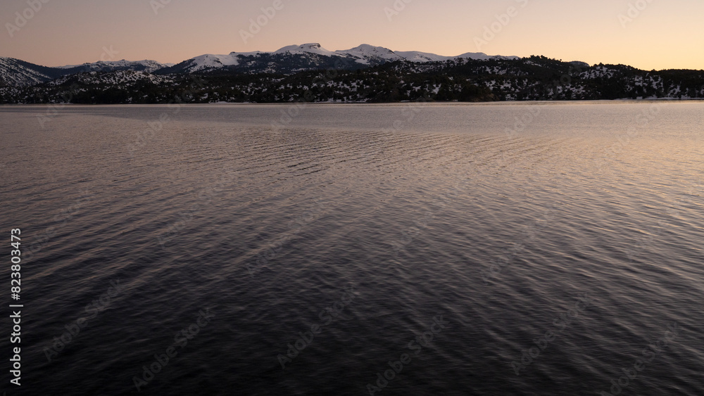 Fototapeta premium Panorama view of the Andes mountains and Alumine lake, at sunset, in Villa Pehuenia, Patagonia Argentina.