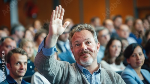 Man Raising Hand at Conference