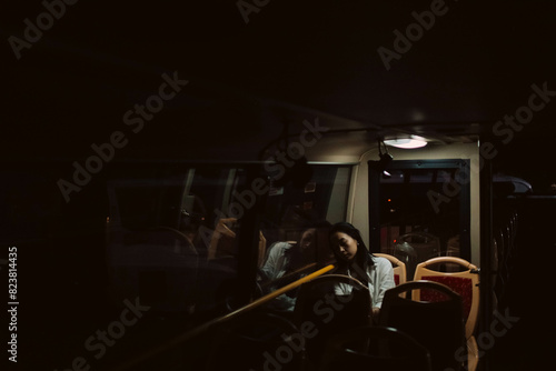 young girl is sleeping in the bus photo