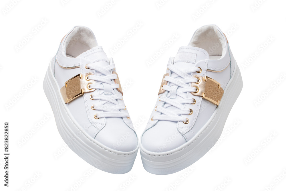 White sneaker isolated. Close-up of a pair white elegant stylish female leather high-heeled sport shoes isolated. Clipping path. Womens shoe fashion. Modern design footwear for workout. White sneaker isolated. Close-up of a pair white elegant stylish female leather high-heeled sport shoes isolated. Clipping path. Womens shoe fashion. Modern design footwear for workout.